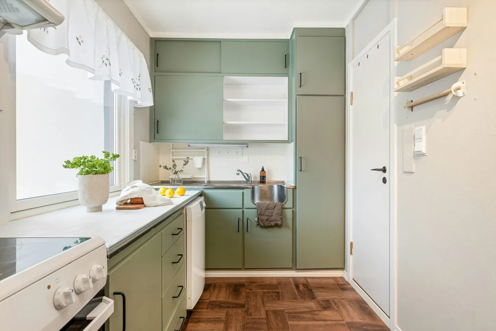 Kitchen with fitted cupboards and appliances
